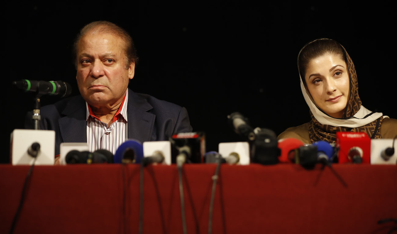 In this file photo, ousted Pakistani prime minister Nawaz Sharif and his daughter Maryam Nawaz attend a UK PMLN Party Workers Convention meeting with supporters in London on July 11, 2018. (TOLGA AKMEN/AFP)