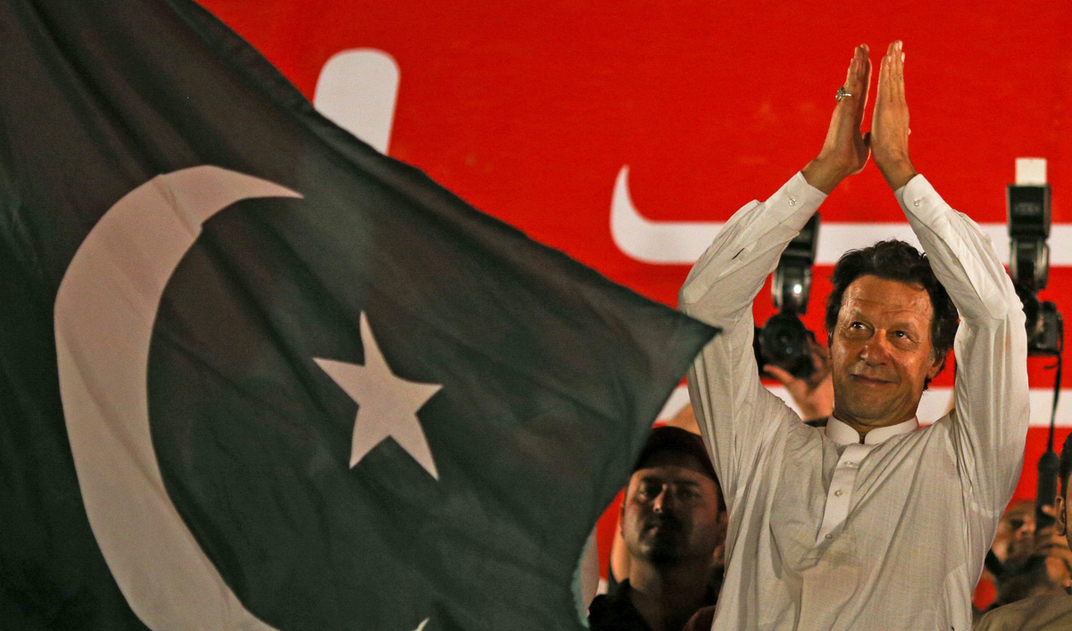 Imran Khan, chairman of the Pakistan Tehreek-e-Insaf (PTI) gestures to his supporters during a campaign meeting ahead of general elections in Islamabad, Pakistan, July 21, 2018. (ATHIT PERAWONGMETHA/REUTERS)