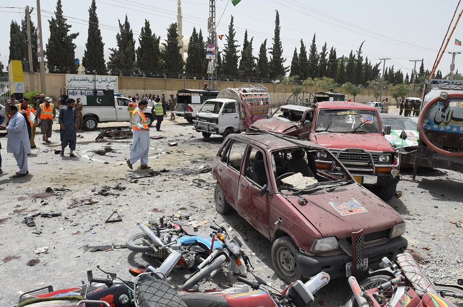 Pakistani security personnel gather at the site of a suicide attack near a polling station in Quetta on July 25, 2018. (Banaras Khan/AFP)