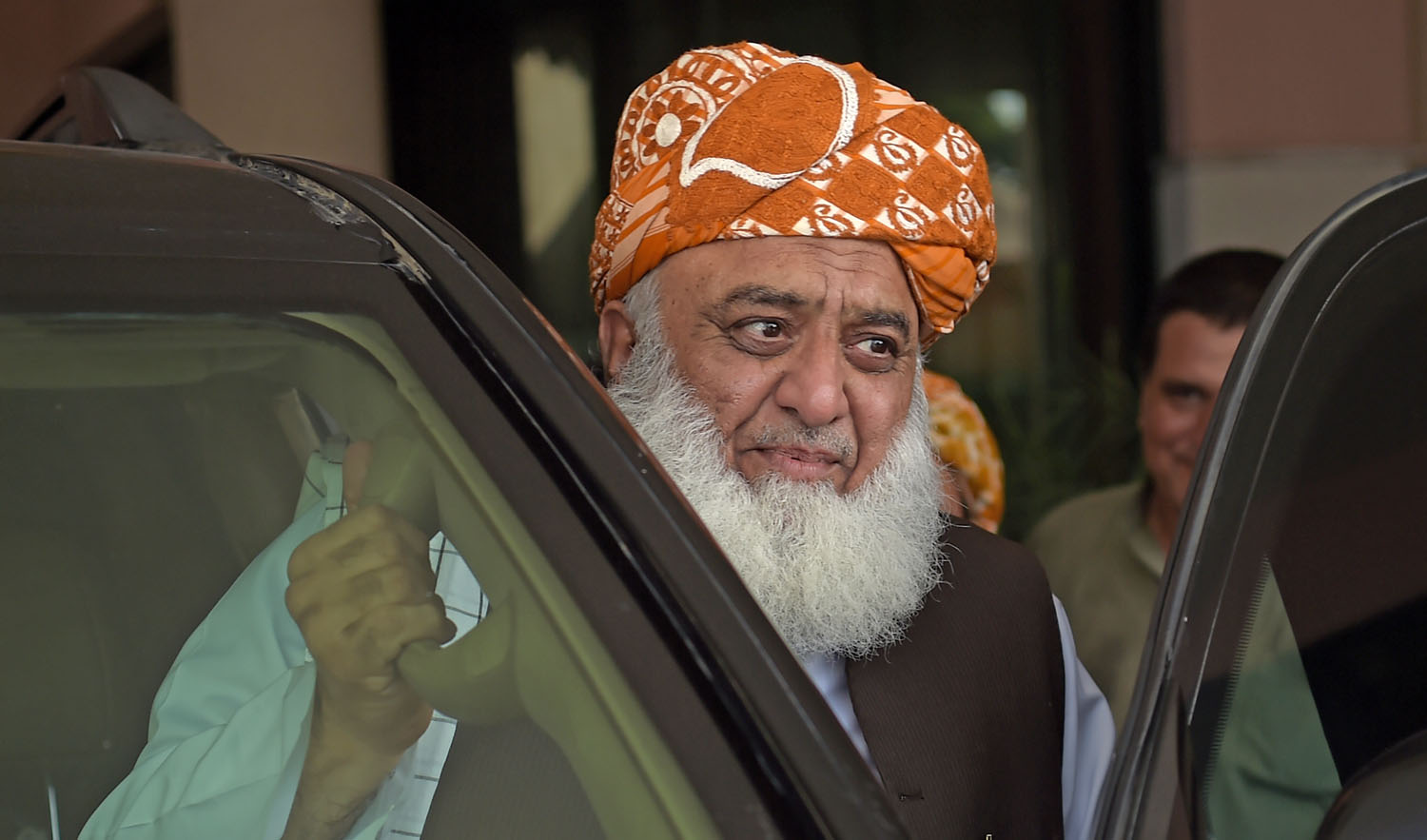 Pakistani opposition leader and head of Muttahida Majlis-e-Amal (MMA), a religious parties alliance, Maulana Fazalur Rehman leaves after attending a meeting in Islamabad on July 31, 2018. (AAMIR QURESHI/AFP)