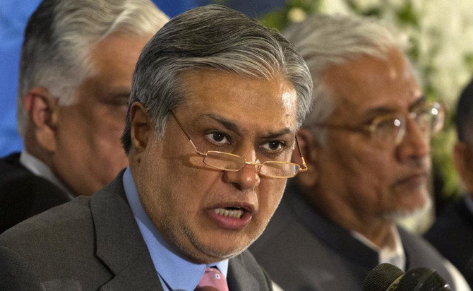 In this file photo, Pakistan's Finance Minister Ishaq Dar announces the result of the first auction for 3G mobile phone networks during a news conference in Islamabad on Apr. 23, 2014. (REUTERS)