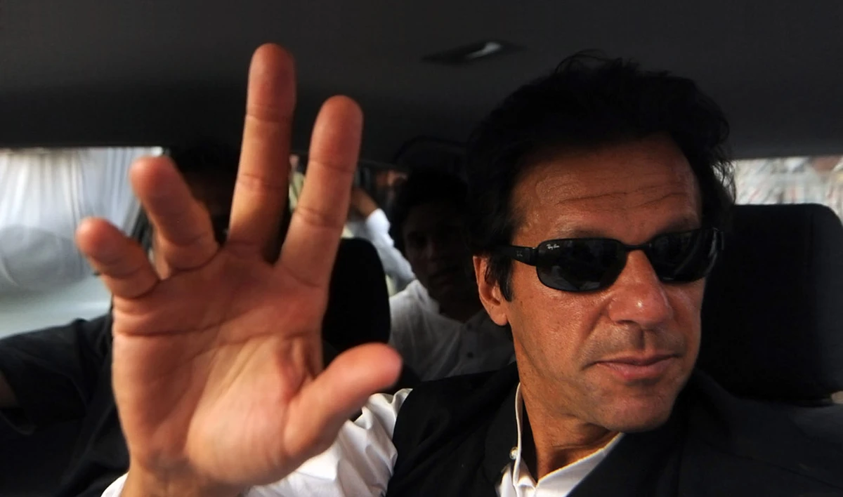 In this file photo, chairman of Pakistan Tehreek-i-Insaf (PTI) Imran Khan waves to supporters upon arrival in Karachi on May 10, 2009. (ASIF HASSAN/AFP)