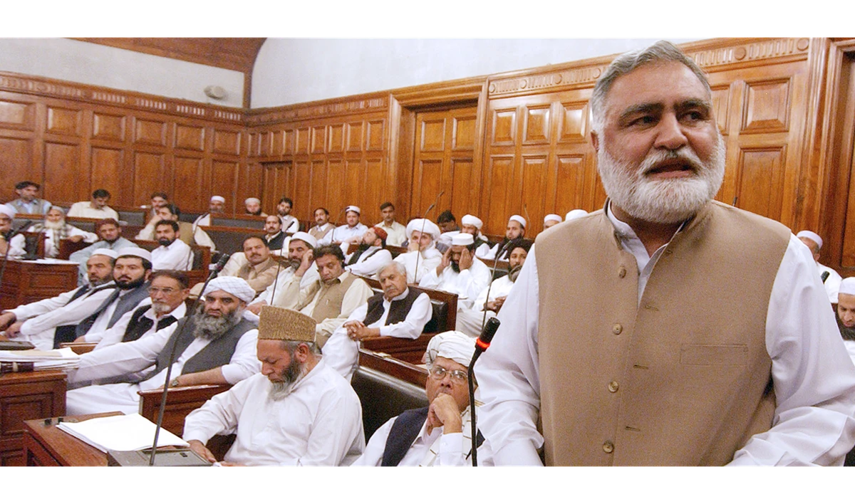 In this file photo, Pakistani North West Frontier Province (NWFP) Chief Minister Akram Durrani, right, delivers a speech at the provincial assembly in Peshawar, Nov. 12, 2006. (TARIQ MAHMOOD/AFP)