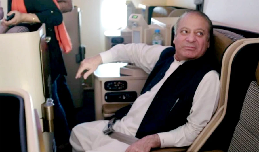 Ousted Pakistani Prime Minister Nawaz Sharif sits on a plane after landing at the Allama Iqbal International Airport in Lahore, Pakistan, July 13, 2018. (REUTERS)