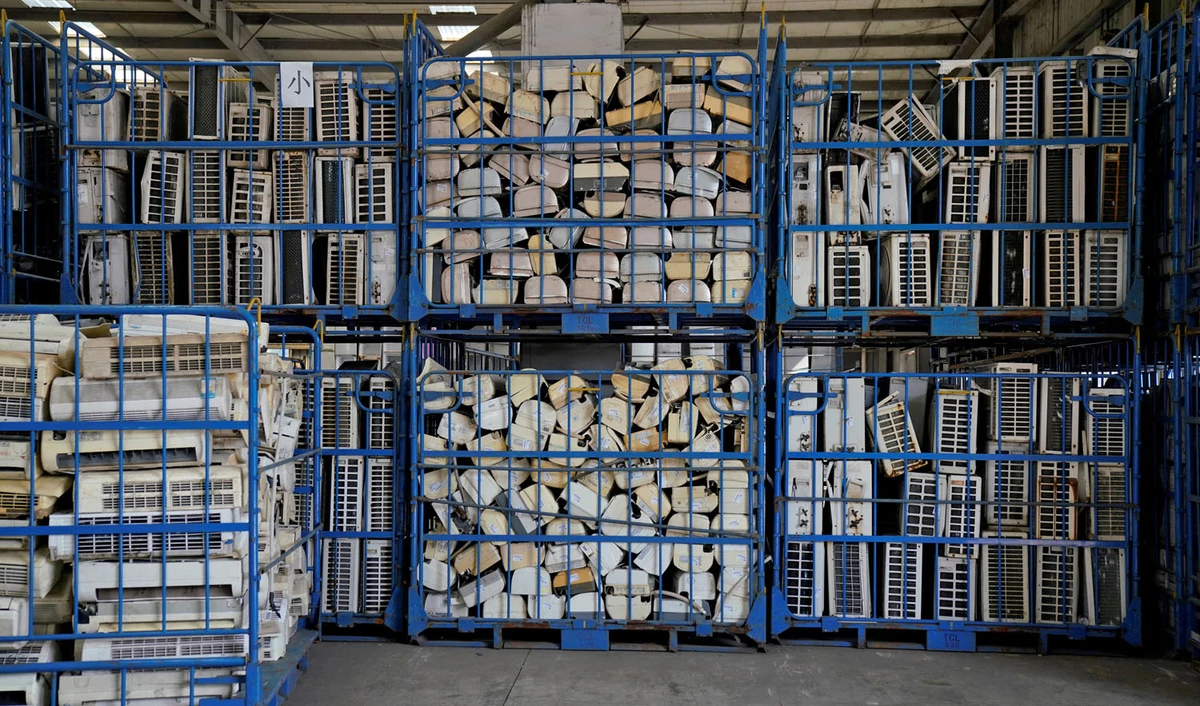 In this file photo, air conditioners about to be recycled are seen in a warehouse at the government-sponsored recycling park in the township of Guiyu, Guangdong Province, China, Jan. 12, 2018. (ALY SONG/REUTERS)