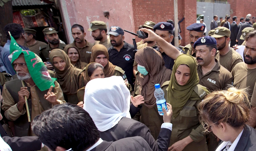 Police officers hold back supporters of Pakistan's jailed ex-Prime Minister Nawaz Sharif as they gather outside the Adiala jail where he is being held, in Rawalpindi, Pakistan, on July 19, 2018. (AP)