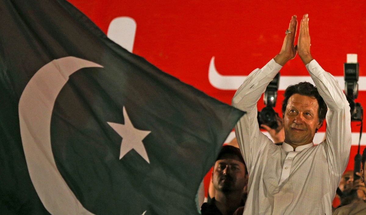 Imran Khan, chairman of the Pakistan Tehreek-e-Insaf (PTI) gestures to his supporters during a campaign meeting ahead of general elections in Islamabad, Pakistan, July 21, 2018. (ATHIT PERAWONGMETHA/REUTERS)