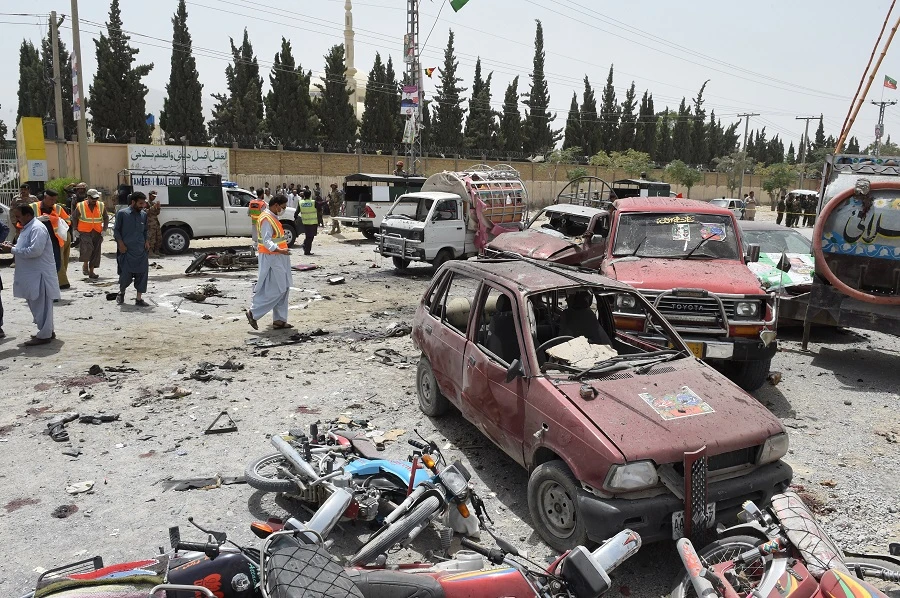 Pakistani security personnel gather at the site of a suicide attack near a polling station in Quetta on July 25, 2018. (Banaras Khan/AFP)
