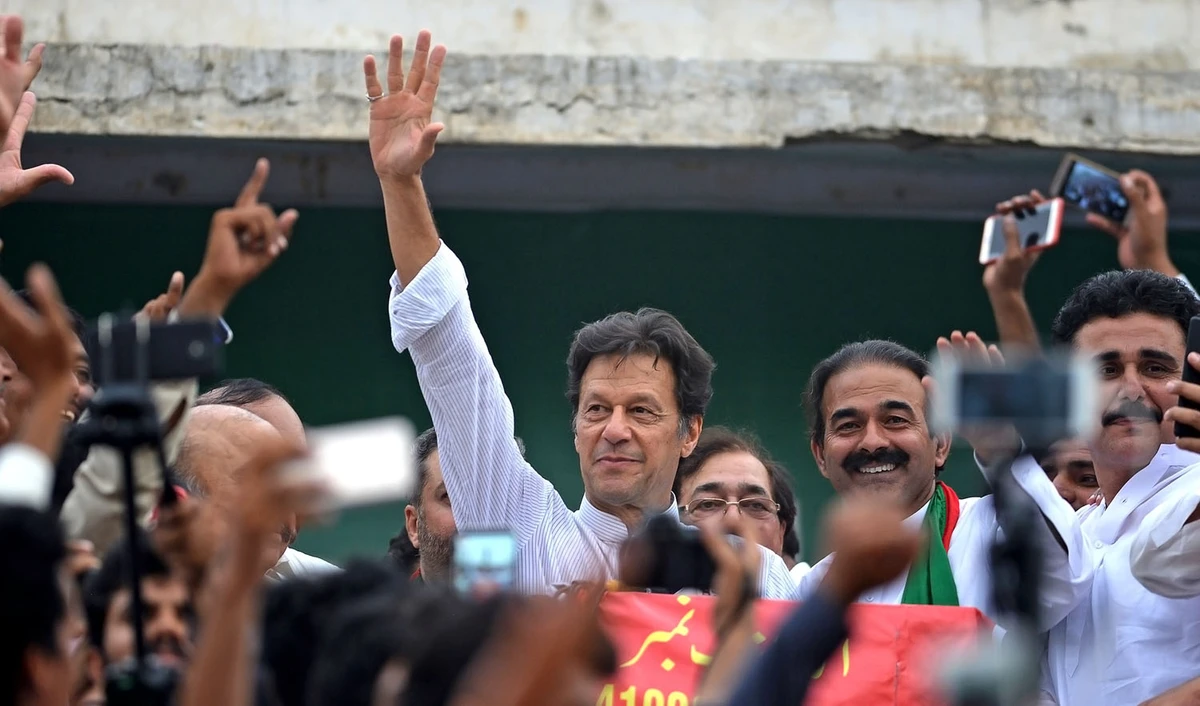 In this file photo, Imran Khan, center, Pakistani cricketer-turned-opposition leader and head of the Pakistan Tehreek-i-Insaf (PTI) delivers a speech during an election campaign in Mianwali, some 240 kms southwest of Islamabad, on June 24, 2018. (AAMIR QURESHI/AFP)