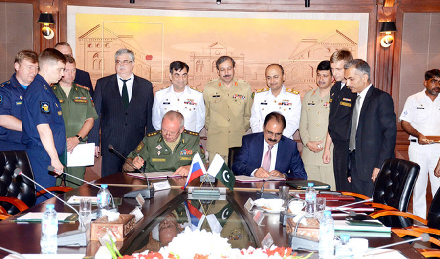 In this file photo, Secretary Defense, Lt. Gen (Retired) Zamir ul Hassan Shah and Russian Deputy Defense Minister Col. Gen. Alexander V. Fomin, signing the MoU at the Pakistan Ministry of Defense in Islamabad. (AN photo)