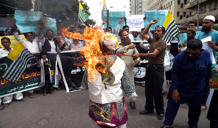 Pakistani demonstrators burn an effigy of Indian Prime Minister Narendra Modi in a protest in Karachi on August 15, 2018. (AFP)