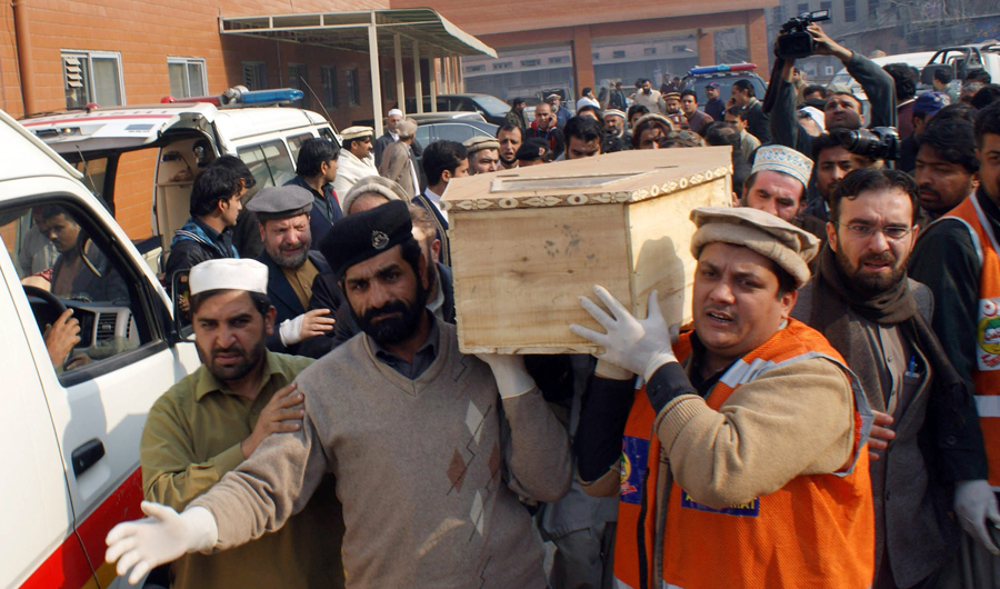 In this December 16, 2014 photo, Pakistani volunteers move the coffin of a student from a hospital following an attack by Taliban gunmen on a school in Peshawar. The attack prompted the Pakistani government to lift a moratorium on executions. (AFP file)