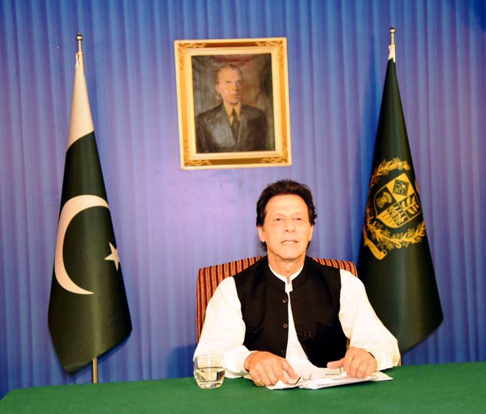 Prime Minister Imran Khan delivering his address to the nation at his office in Islamabad on August 19, 2018. (Press Information Department handout photo)