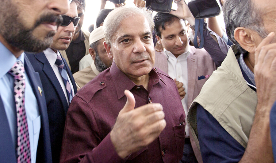 Pakistani opposition leader Shahbaz Sharif, center, who lost election for the premiership of Pakistan, arrives at the National Assembly in Islamabad, Pakistan, on Aug. 17, 2018. (AP)