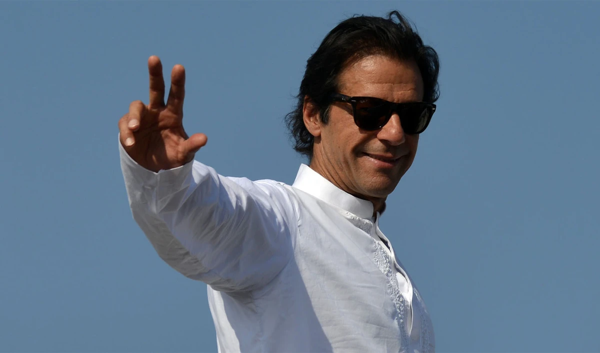 In this file photo, Pakistan Tehreek-e-Insaf (PTI) chief Imran Khan gestures to supporters at the site of an anti-government protest in front of the Parliament in Islamabad on Aug. 29, 2014. (AAMIR QURESHI/AFP)