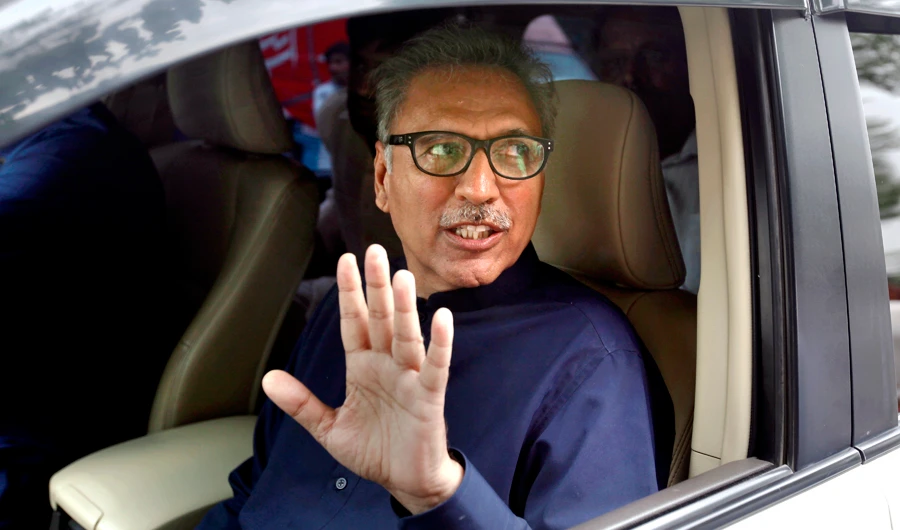 Arif Alvi, a lawmaker from ruling Imran Khan' s Tehreek-e-Insaf party waves to media after filing his nomination papers for presidential election, in Islamabad, Pakistan, on Aug. 27, 2018. (AP)
