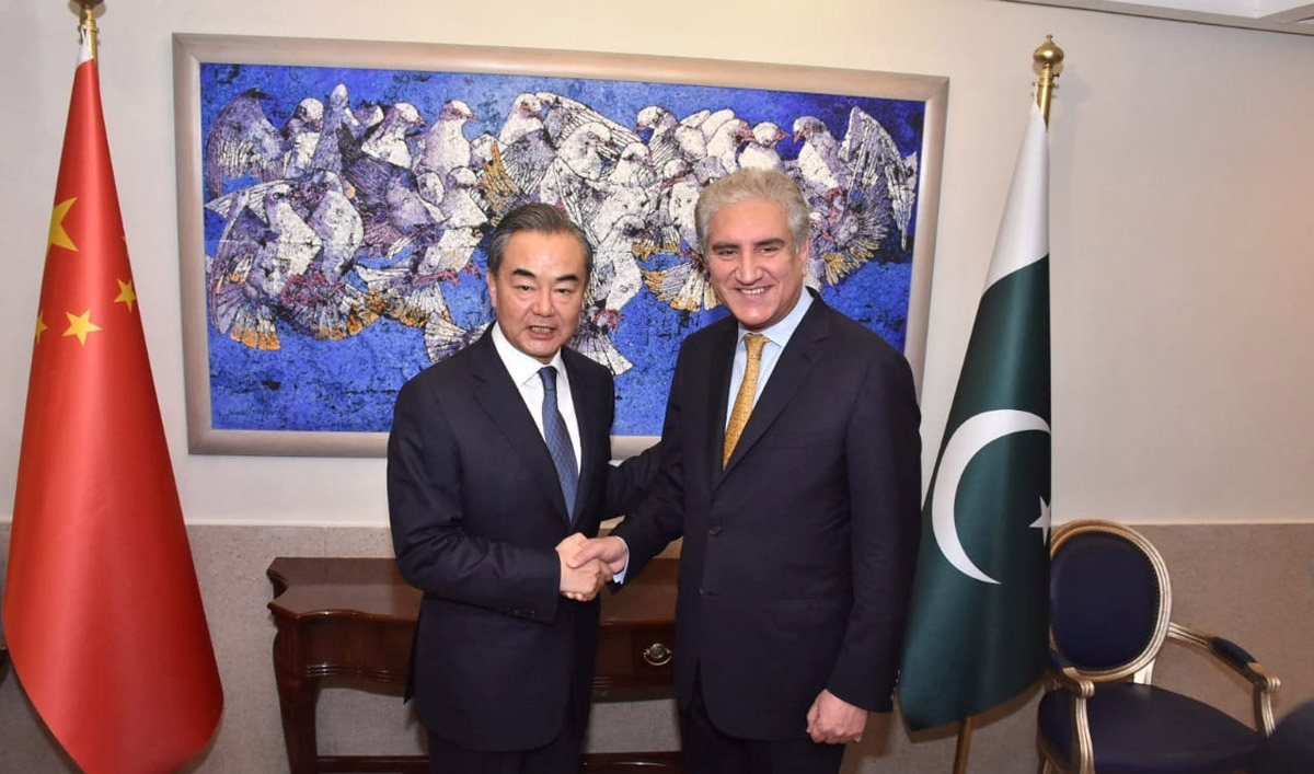 Pakistan’s Foreign Minister Shah Mehmood Qureshi shakes hand with State Councillor and Foreign Minister Wang Yi at the Ministry of Foreign Affairs in Islamabad, Pakistan, September 8, 2018. (Ministry of Foreign Affairs (MFA)/Handout via REUTERS)
