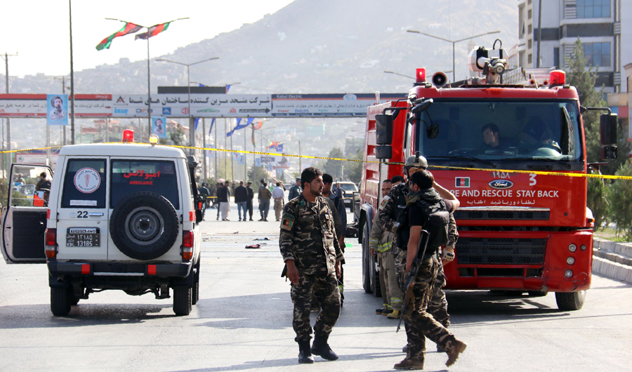 Afghan security personnel inspect a site following a suicide attack in Kabul on September 9, 2018. A suicide bomber on a motorbike blew himself up near a convoy of gunmen commemorating the death anniversary of a famed resistance leader in Kabul on September 9, killing at least seven people, officials said. (AFP)