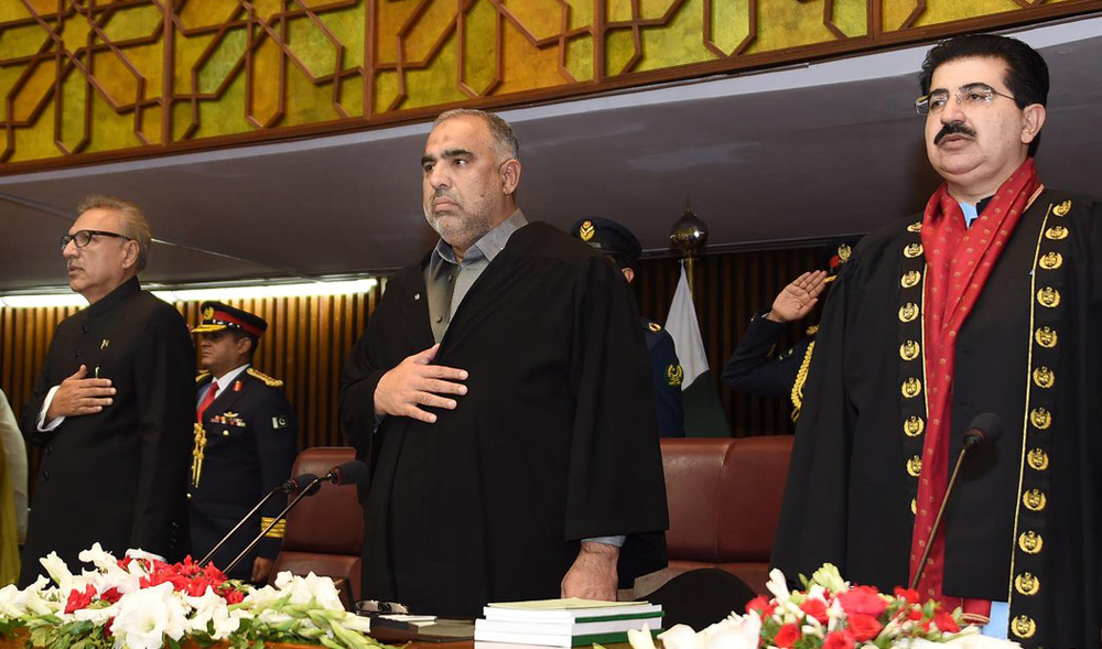 President Arif Alvi, left, Speaker National Assembly Asad Qaiser, center, and Chairman Senate Sadiq Sanjrani listening to National Anthem before the President’s address to the Joint Session of the Parliament on Monday. (Photo courtesy: National Assembly)