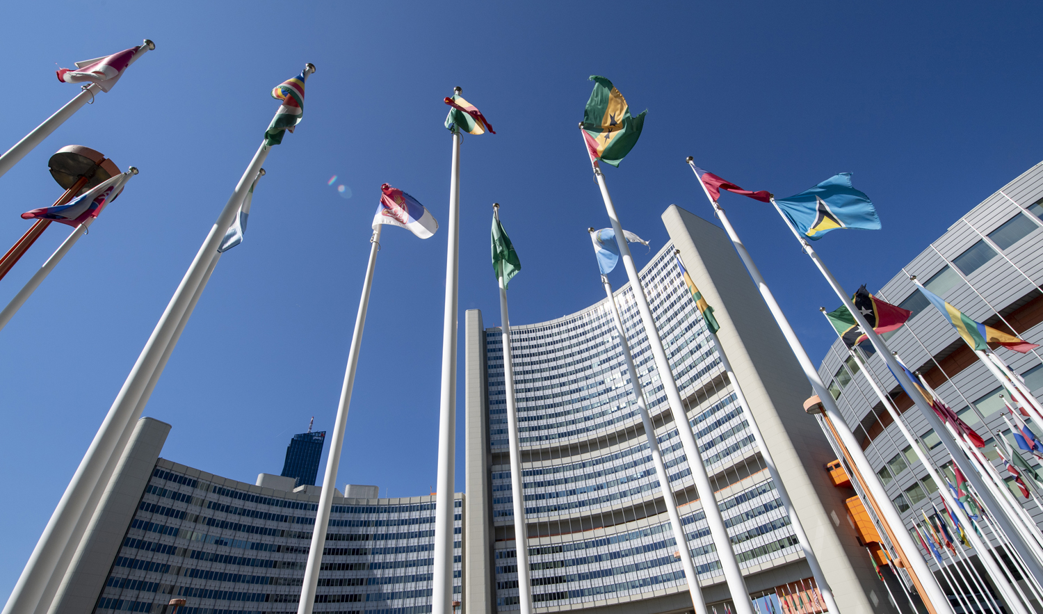 International flags flutter outside of the UN headquarters during the opening of the International Atomic Energy Agency (IAEA) Board of Governors meeting at the IAEA headquarters in Vienna, Austria on Sept. 10, 2018. (AFP)