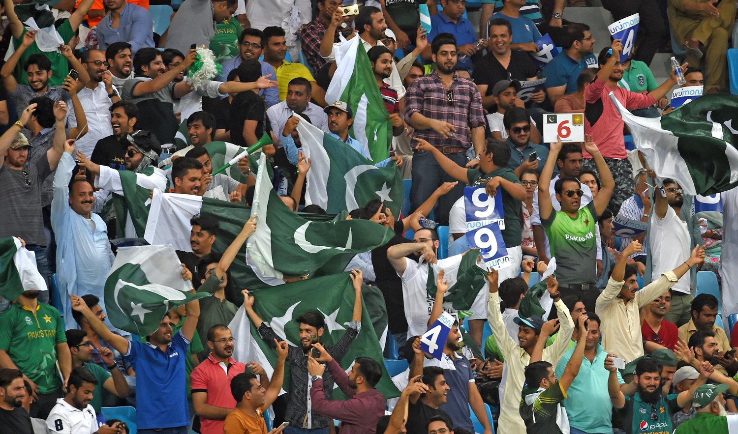 In this file photo, Pakistan cricket fans cheer in support of their national team during the one day international (ODI) Asia Cup cricket match between Pakistan and India at the Dubai International Cricket Stadium in Dubai on Sept. 19, 2018. (AFP)