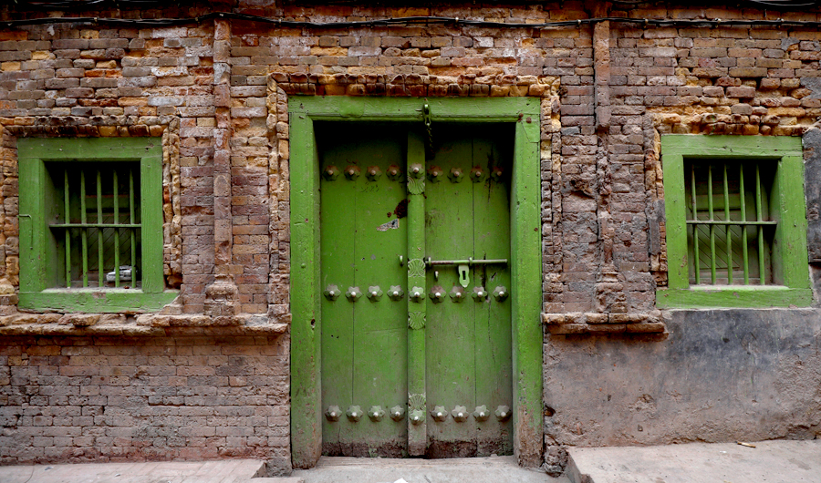 The entrance door and windows of an old house are seen in Peshawar, Pakistan on Sept. 28, 2018. (REUTERS)