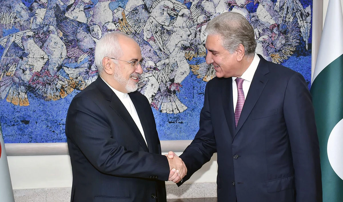 Foreign Minister of Pakistan Shah Mahmoud Quraishi greets his Iranian counterpart Jawad Zarif in Islamabad. Zarif’s visit came days before the expected arrival of US Secretary of State Michael Pompeo in Pakistan. (Press Information Department via AFP)