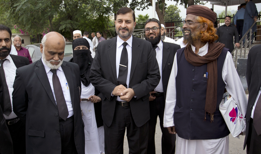 Pakistani lawyers who are contesting the case against Asia Bibi, a Pakistani Christian woman convicted of blasphemy, leave the Supreme court building in Islamabad, Pakistan, on Oct. 8, 2018. (AP)