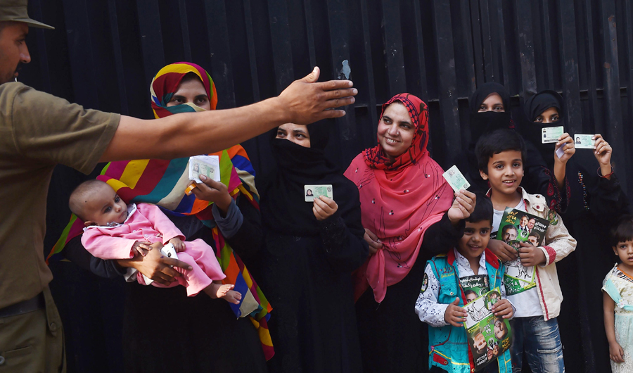 Pakistani women voters lineup outside the poling station during the by-election in Lahore on Oct. 14, 2018. Over 100 candidates are contesting for 35 National Assembly and provincial assembly seats in the by-election on Oct. 14. (AFP)