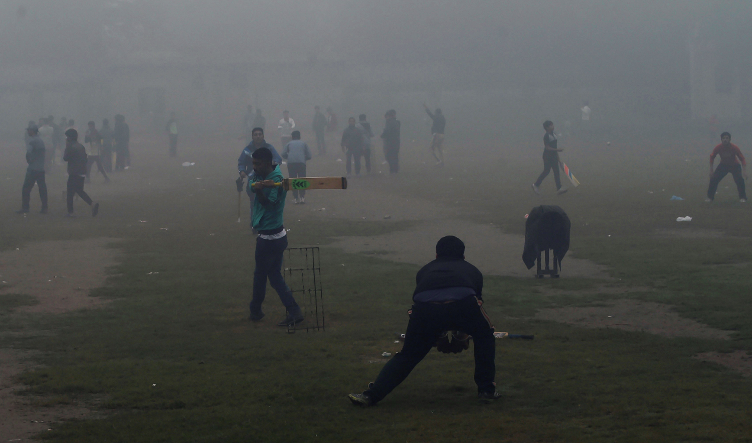 In this file photo, Pakistani youths play cricket amid heavy smog in Lahore on Nov. 12, 2017. (AFP)