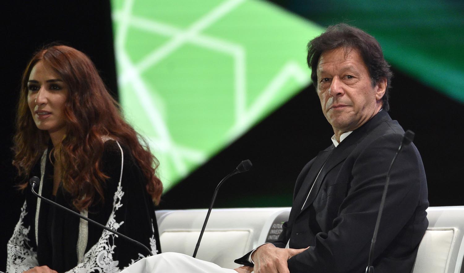 Pakistani Prime Minister Imran Khan, right, seen during the opening ceremony of the Future Investment Initiative (FII) conference in Riyadh on Oct. 23, 2018. (AFP)