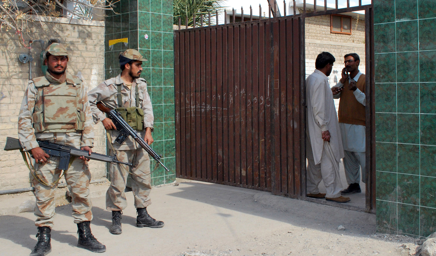 In this file photo, Pakistani security personnel stand guard at a state-run junior school after a grenade attack in Balochistan province capital Quetta on Nov. 7, 2009. (AFP)