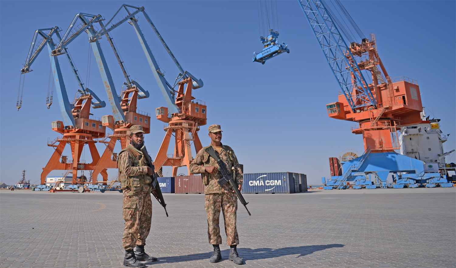 In this file photo, Pakistani Naval personnel stand guard near a ship carrying containers at the Gwadar port during the opening ceremony of a pilot trade program between Pakistan and China on Nov.13, 2016. (AFP)