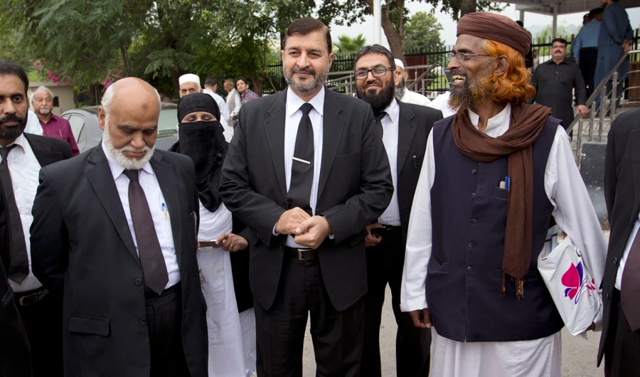 Pakistani lawyers who are contesting the case against Asia Bibi, a Pakistani Christian woman convicted of blasphemy, leave the Supreme court building in Islamabad, Pakistan, on Oct. 8, 2018. (AP)