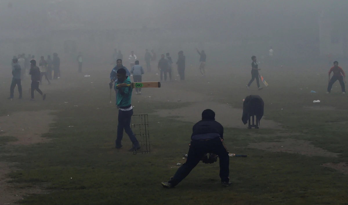 In this file photo, Pakistani youths play cricket amid heavy smog in Lahore on Nov. 12, 2017. (AFP)