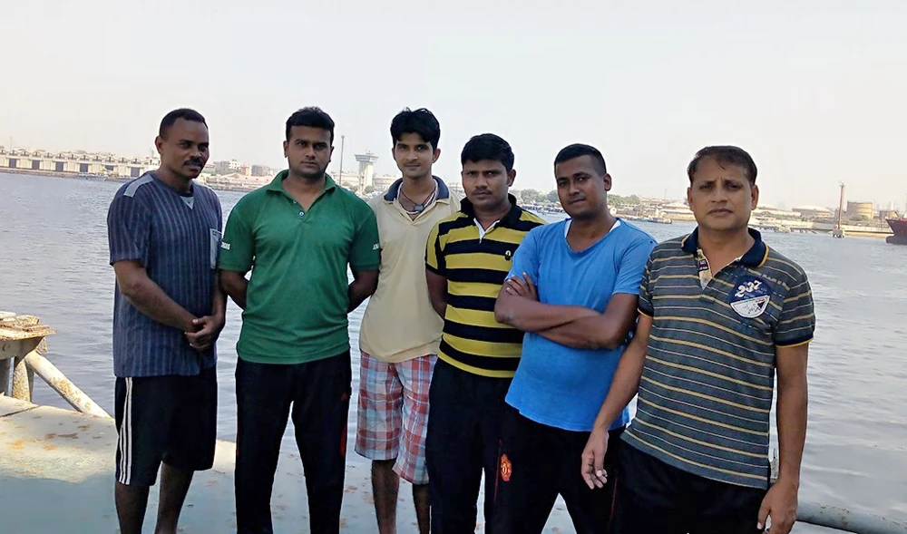 Indian nationals Amit Kumar, Rama Shankar Prasad, Niraj Kumar, Rajendra Kumar and Rajesh Shikh with Sudanese citizen Khalid Noor aboard Cargo Ship at Karachi Port. (Photo supplied by the ship crew)