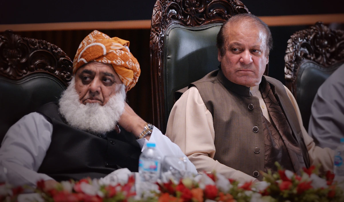 Maulana Fazl-ur-Rehman, left, with former prime minister Nawaz Sharif during a seminar in Islamabad on April 17, 2018 (AFP/File)