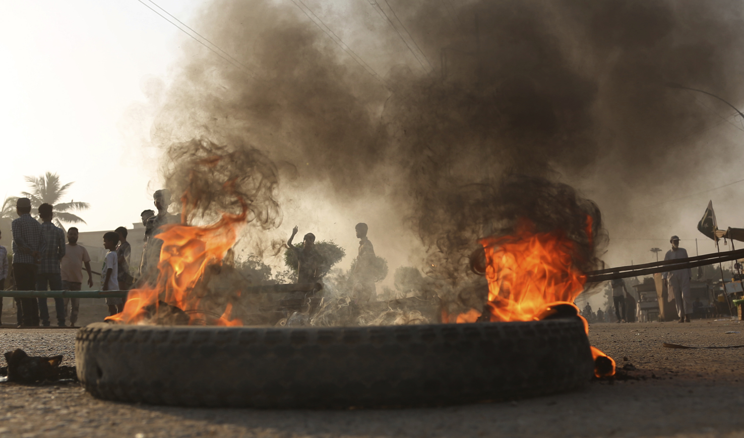 Pakistani protesters burn tires while blocking a main road during a protest after a court decision, in Karachi, Pakistan, Thursday, Nov. 1, 2018. (AFP/File)