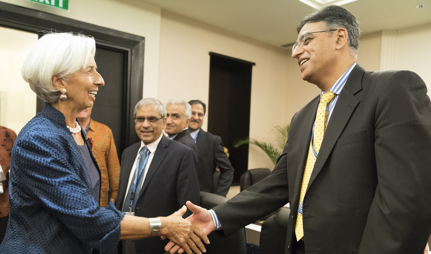 Finance Minister Asad Umar, left, and IMF chief Christine Lagarde shake hands during Bali IMF-World meetings held in Bali in Bali, Indonesia on Oct. 11, 2018. (AFP)
