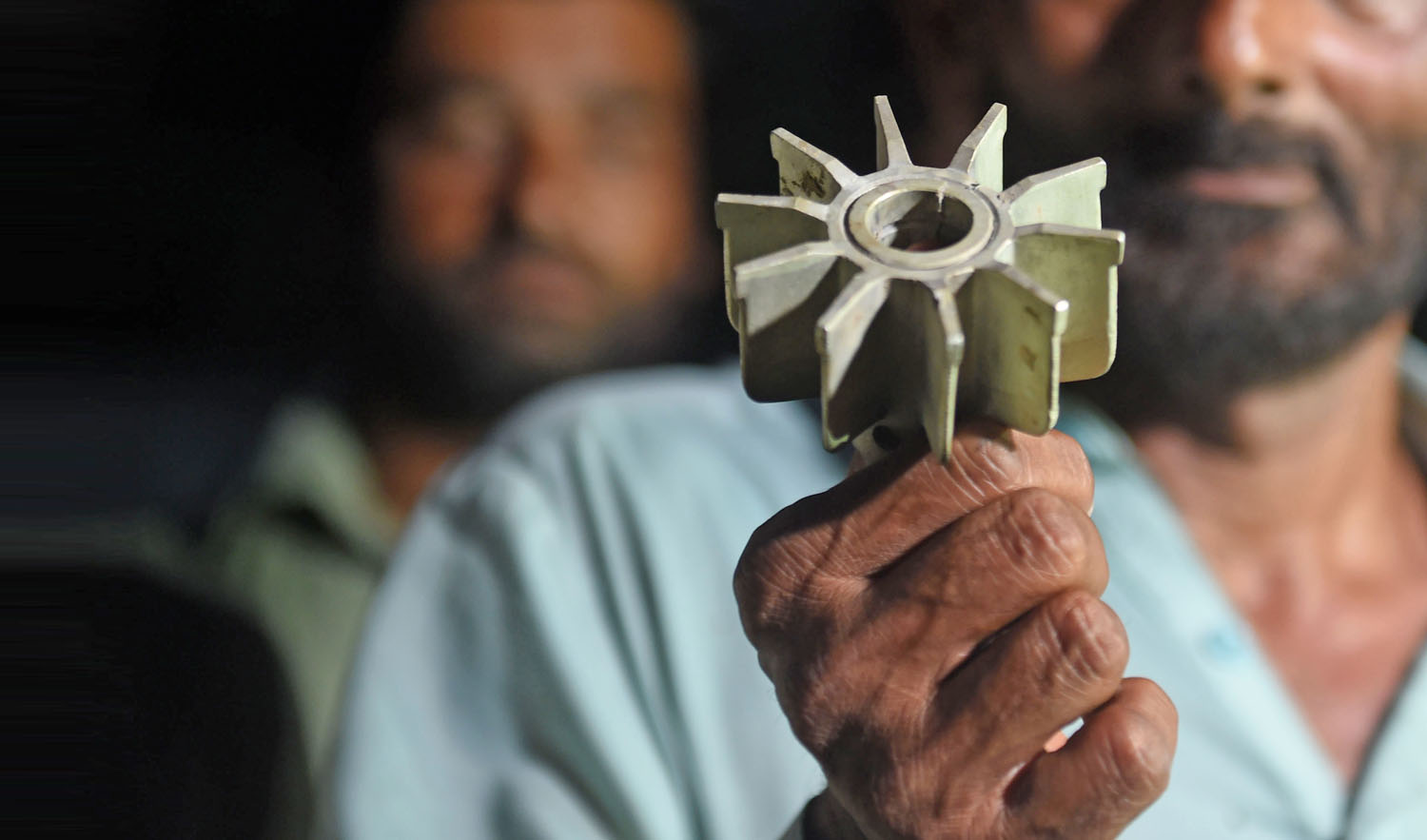 In this file photo, a Pakistani villager displays a mortar shell following cross-border shelling by Indian Border Security Force (BSF) at Dani Slariya village along the Sialkot Working Boundary in Pakistan’s Punjab province on Sept. 22, 2017. (AFP)