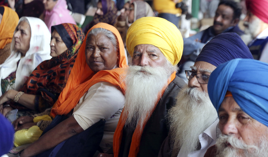 Visiting Indian Sikh pilgrims attend a ceremony in Kartarpur, Pakistan, on Wednesday, Nov. 28, 2018. (AP Photo/K.M. Chaudary)