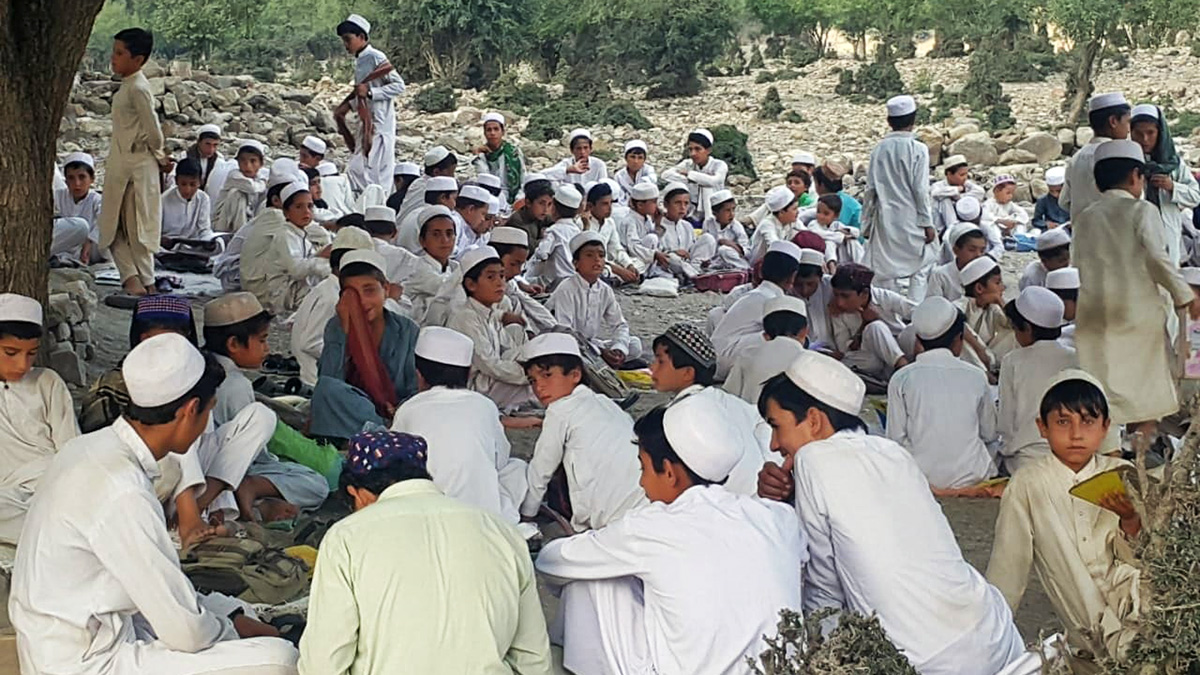 Schoolchildren study under the sky in Shaga, South Waziristan district, on July 24, 2019. (Photo courtesy: Mahsud Welfare Association)
