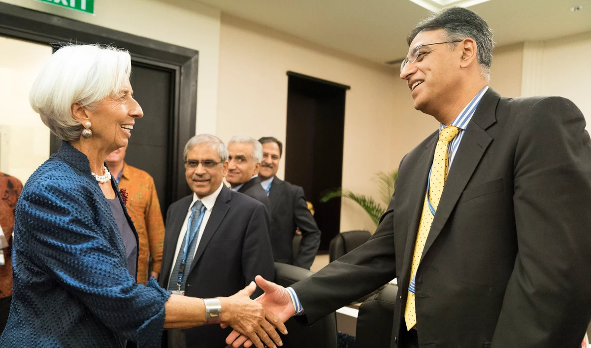 Finance Minister Asad Umar, left, and IMF chief Christine Lagarde shake hands during Bali IMF-World meetings held in Bali in Bali, Indonesia on Oct. 11, 2018. (AFP)