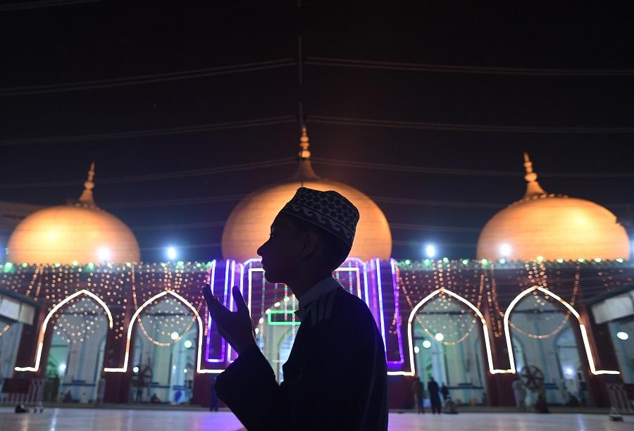 A Pakistani Muslim prays at an illuminated mosque in connection with Eid-e-Milad-un-Nabi, the birthday of Prophet Mohammad, in Karachi on November 20, 2018. (File/AFP)