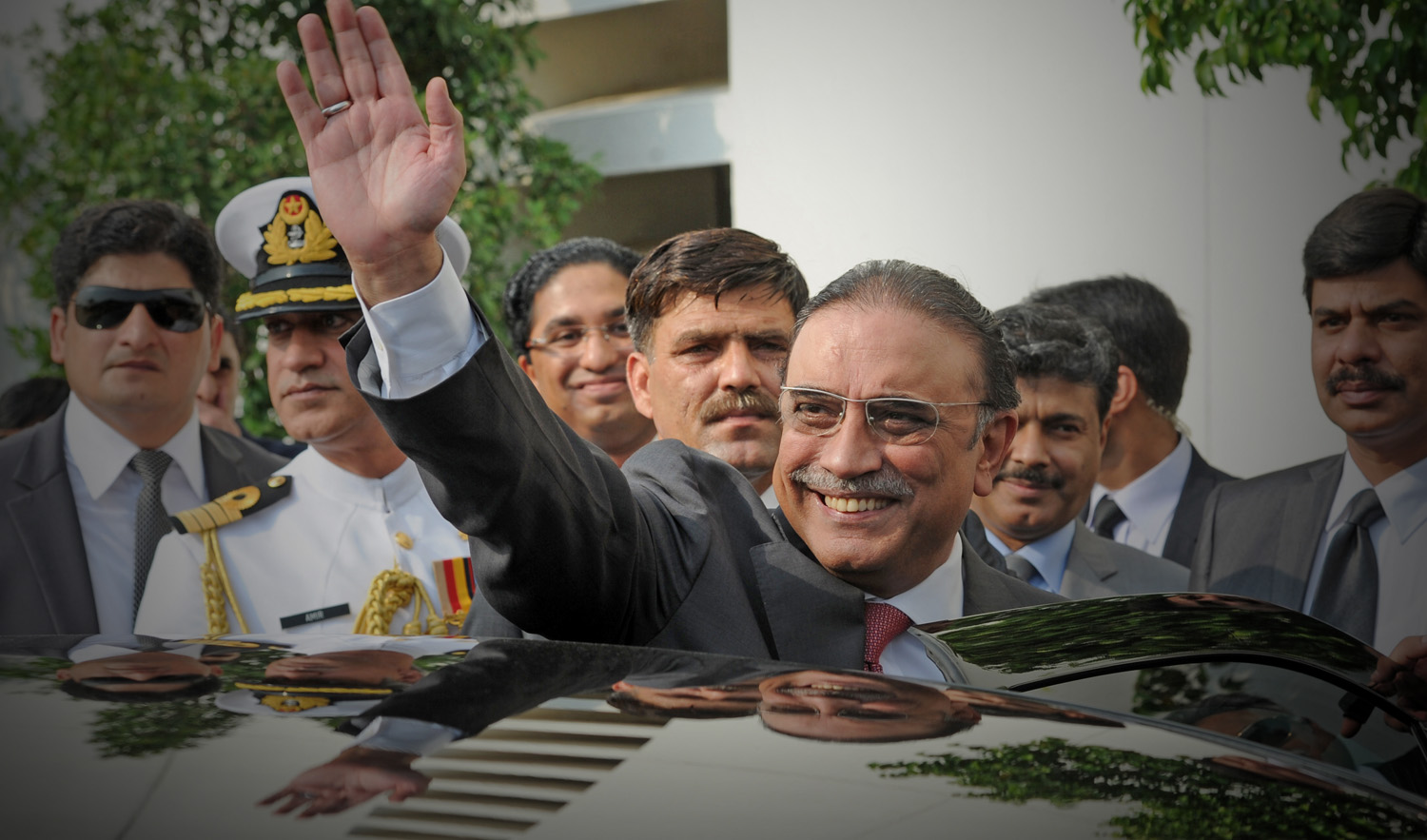 In this file photo, former Pakistan President Asif Ali Zardari waves as he leaves the Presidential Palace after his farewell ceremony in Islamabad on Sept. 8, 2013. (AFP)