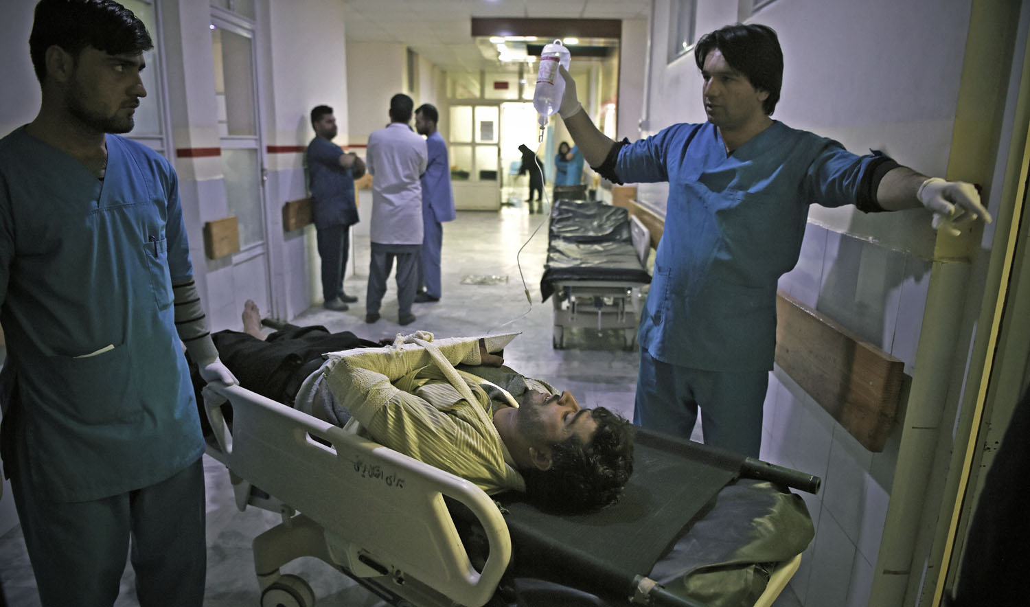 A wounded Afghan man receives treatments at the Wazir Akbar Khan hospital after a car bomb attack in Kabul on Dec. 24, 2018. (AFP)