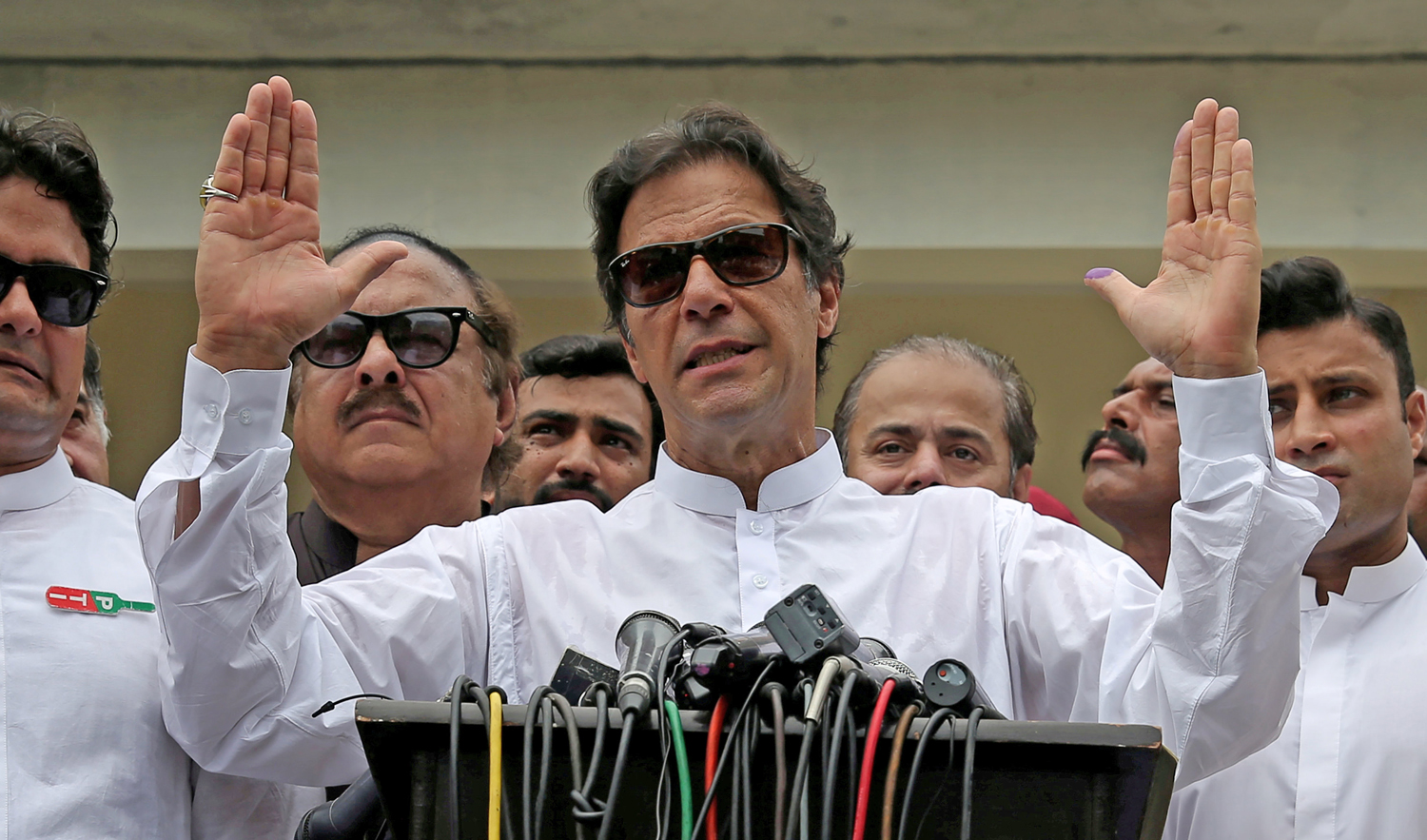 In this file photo, Pakistani Prime Minister Imran Khan speaks to members of media after casting his vote at a polling station during the general election in Islamabad, Pakistan, July 25, 2018. (REUTERS)