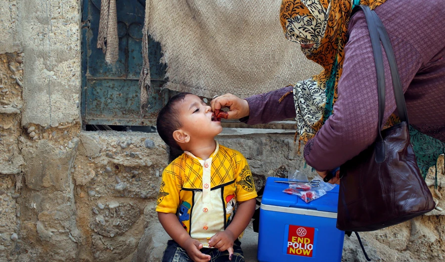 In this file photo, A boy receives polio vaccine drops, during an anti-polio campaign, in a low-income neighbourhood in Karachi, Pakistan on April 9, 2018. (REUTERS)