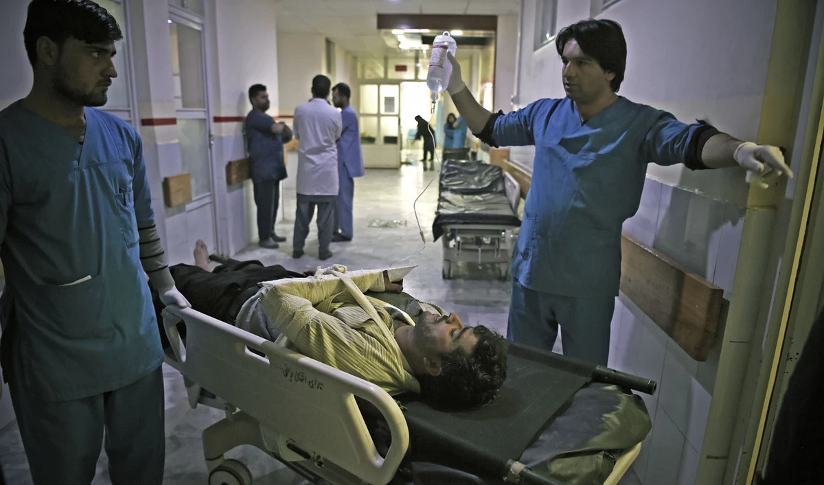 A wounded Afghan man receives treatments at the Wazir Akbar Khan hospital after a car bomb attack in Kabul on Dec. 24, 2018. (AFP)