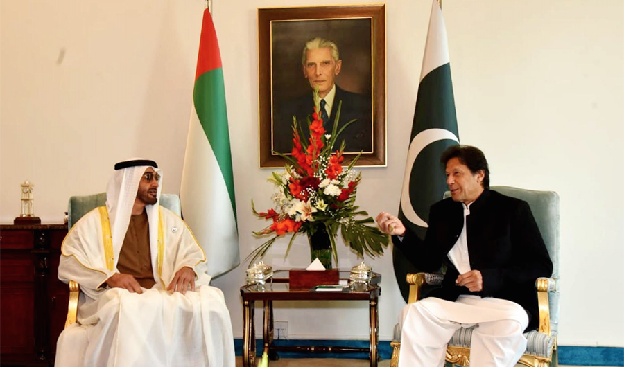 Pakistan's Prime Minister Imran Khan (R) speaks with Abu Dhabi's Crown Prince Sheikh Mohammed bin Zayed Al-Nahyan during a meeting at the Prime Minister House in Islamabad. (AFP)